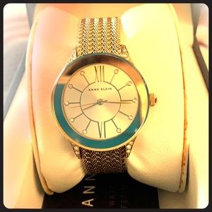 Woman’s gold tone watch.